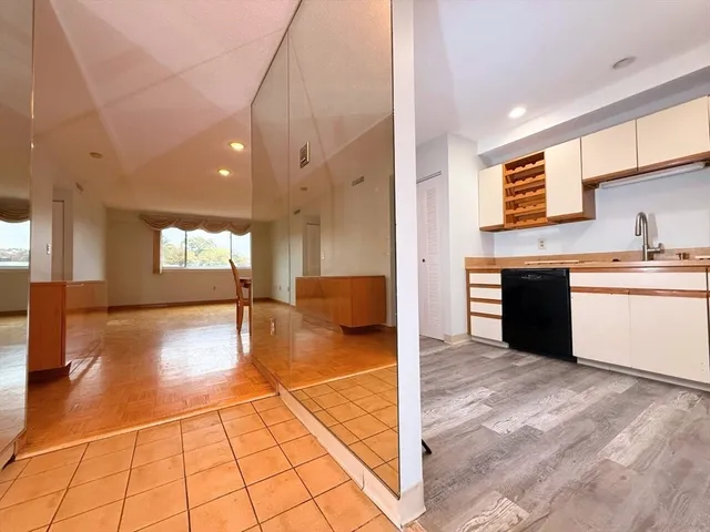a bathroom with a tub a toilet and a shower