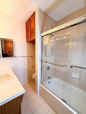 a view of room with furniture and wooden floor