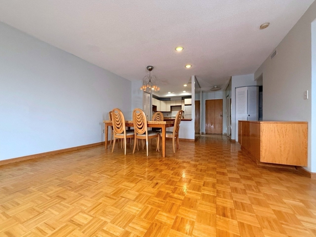 1850 Beacon Street, Unit 502 Brookline, MA 02445 - Photo 2 of 16 a view of a dining room with furniture