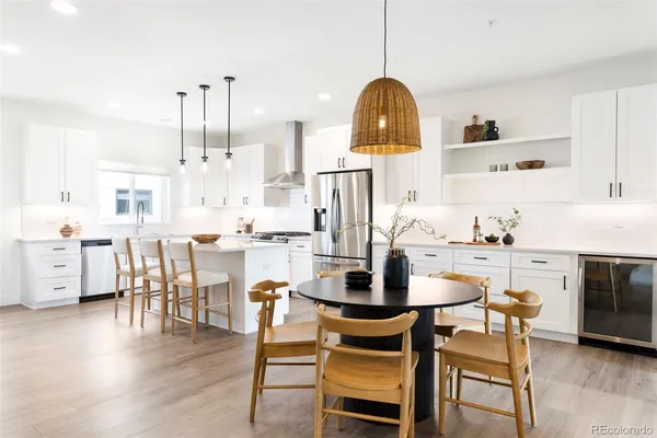 a dining room with furniture a window and kitchen view