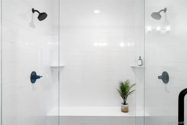 a bathroom with a sink vanity and mirror