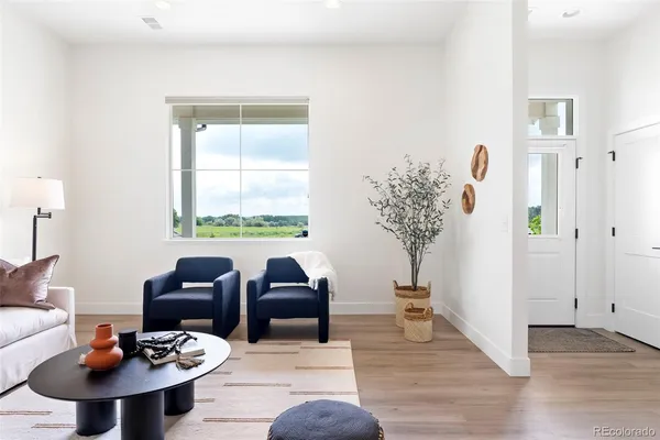a living room with furniture and a table