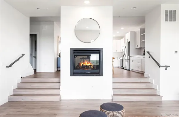 a dining room with furniture and a fireplace
