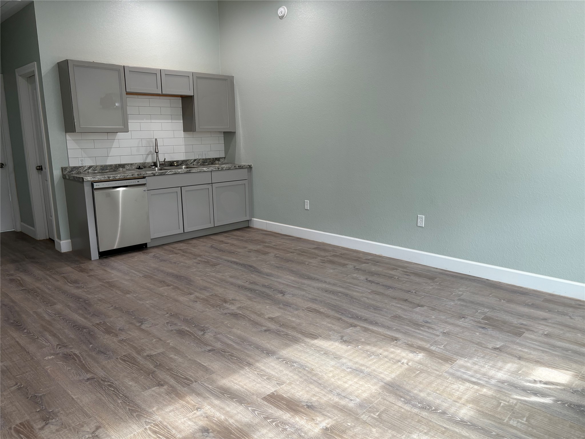 120 Boxwoods Lane Bastrop, TX 78602 - Photo 3 of 7 a kitchen with stainless steel appliances a sink stove and cabinets