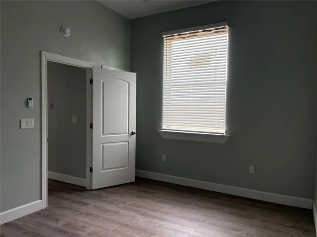 a view of a room that has a large window