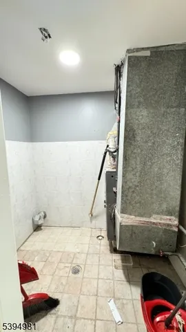 a bathroom with a tub and shower