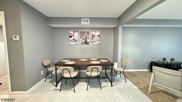 a view of a dining table and chairs in a room