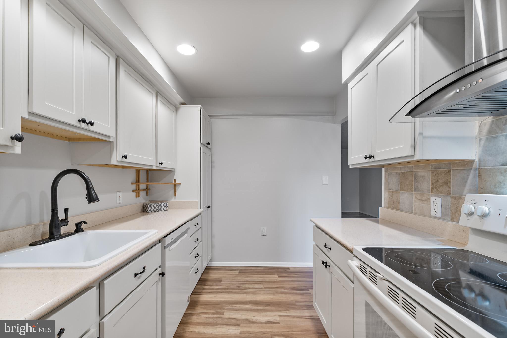 2 Finsbury Park Court, Unit 47A Silver Spring, MD 20906 - Photo 11 of 24 a kitchen with stainless steel appliances granite countertop a sink and cabinets
