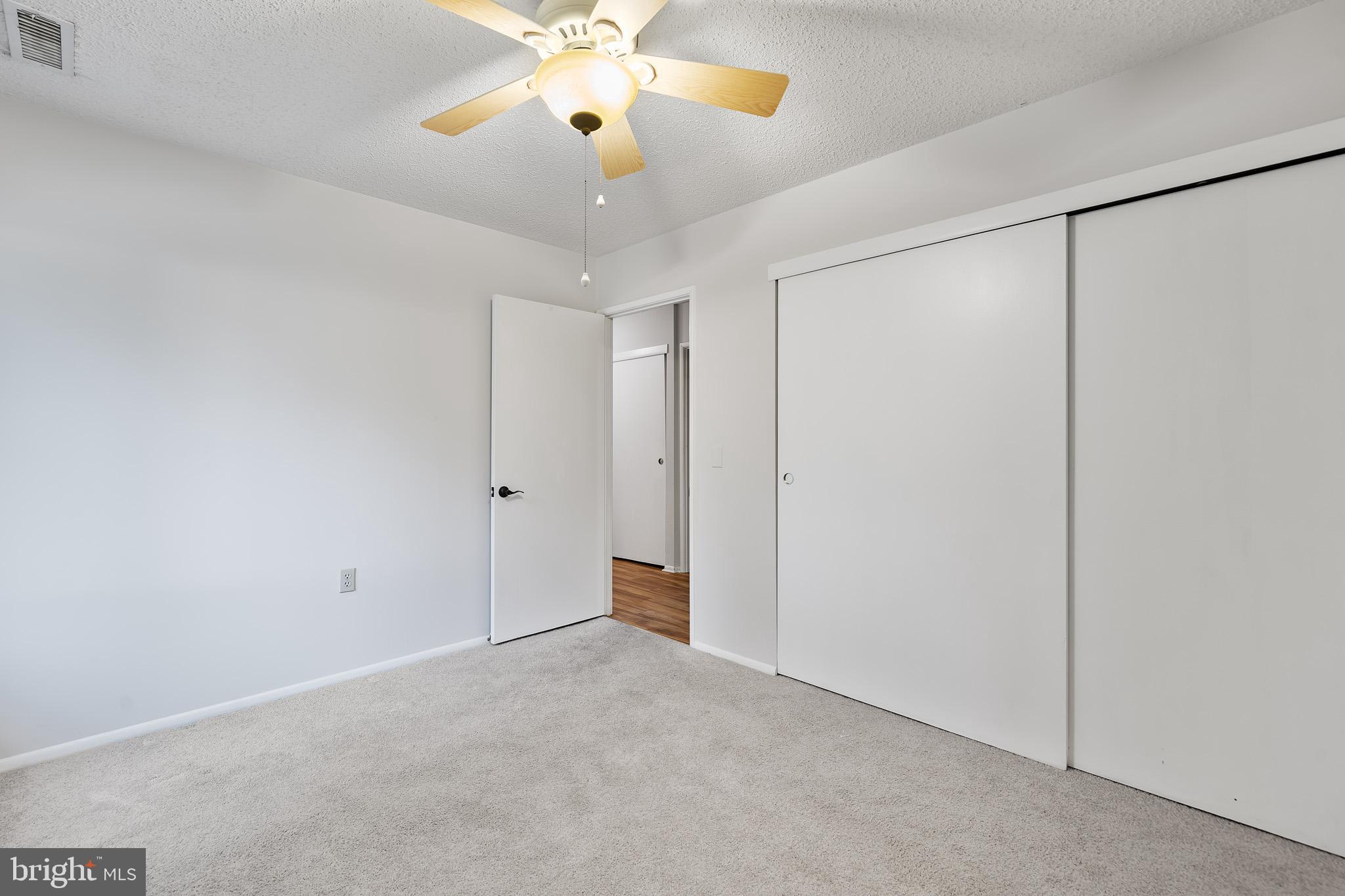2 Finsbury Park Court, Unit 47A Silver Spring, MD 20906 - Photo 18 of 24 an empty room with closet and a chandelier fan