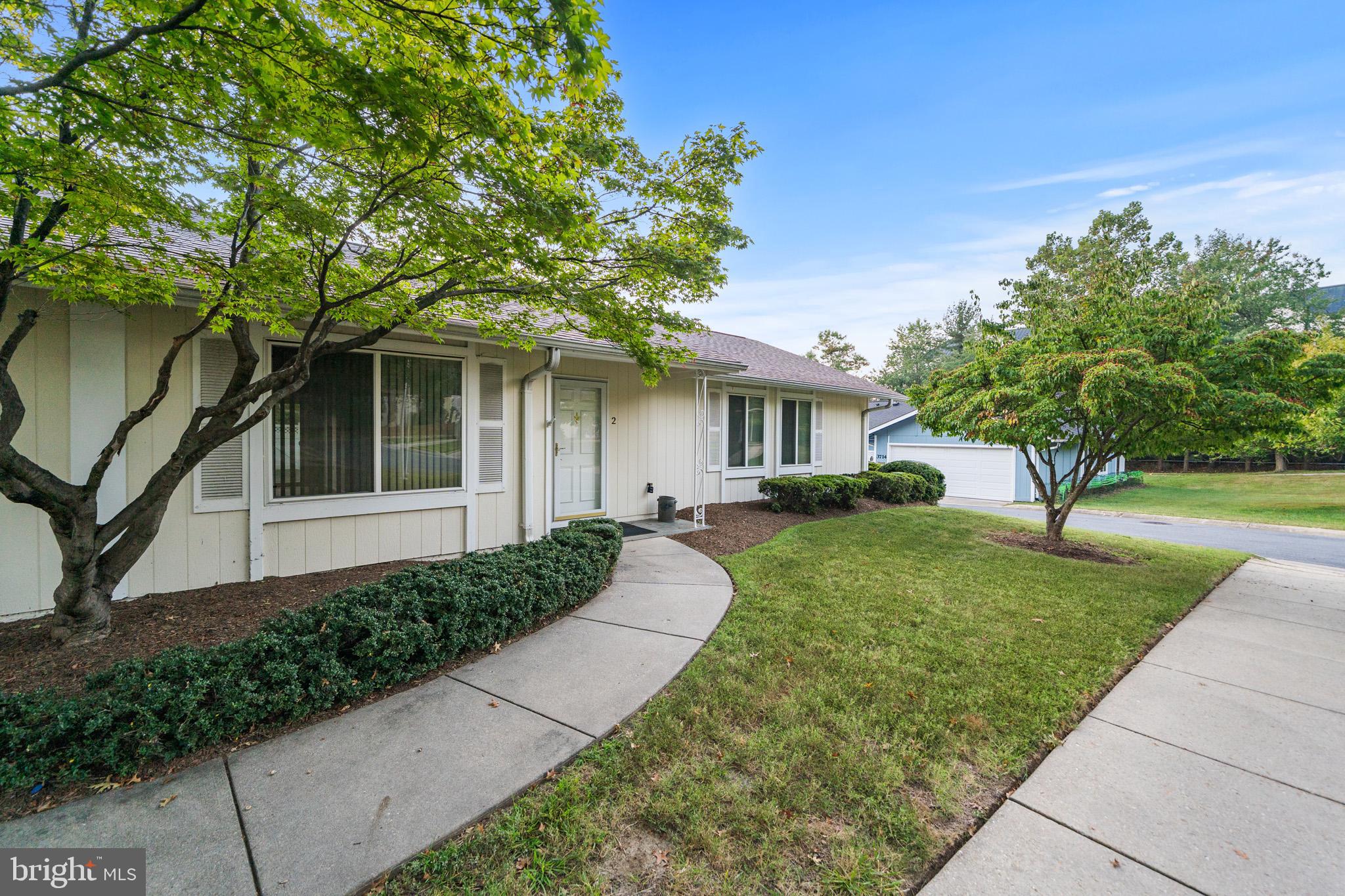 2 Finsbury Park Court, Unit 47A Silver Spring, MD 20906 - Photo 23 of 24 a front view of a house with a yard