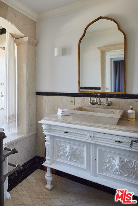 3817 Surfwood Road Malibu, CA 90265 - Photo 15 of 26 a bathroom with a sink and a mirror