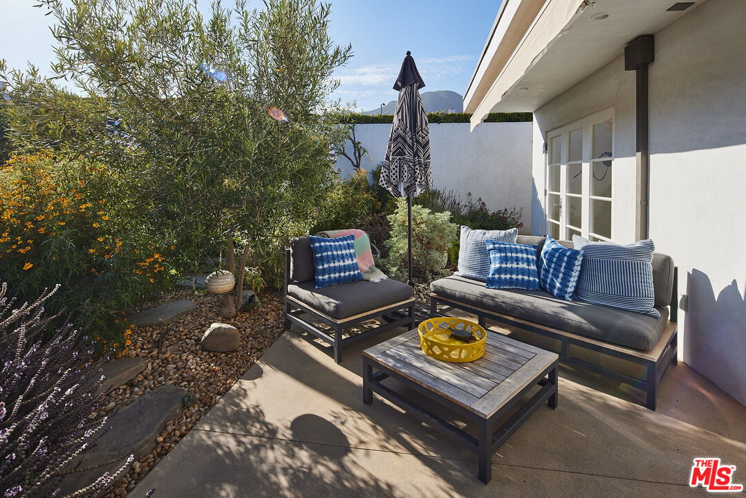 3817 Surfwood Road Malibu, CA 90265 - Photo 18 of 26 a outdoor living space with furniture
