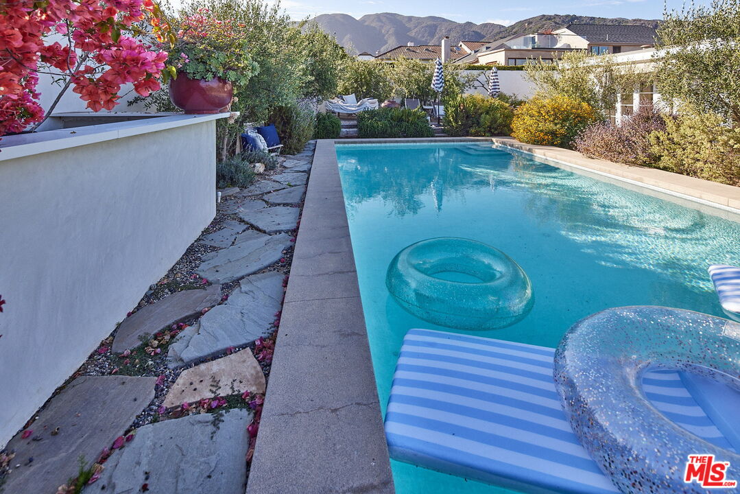 3817 Surfwood Road Malibu, CA 90265 - Photo 21 of 26 a view of a chairs in a patio