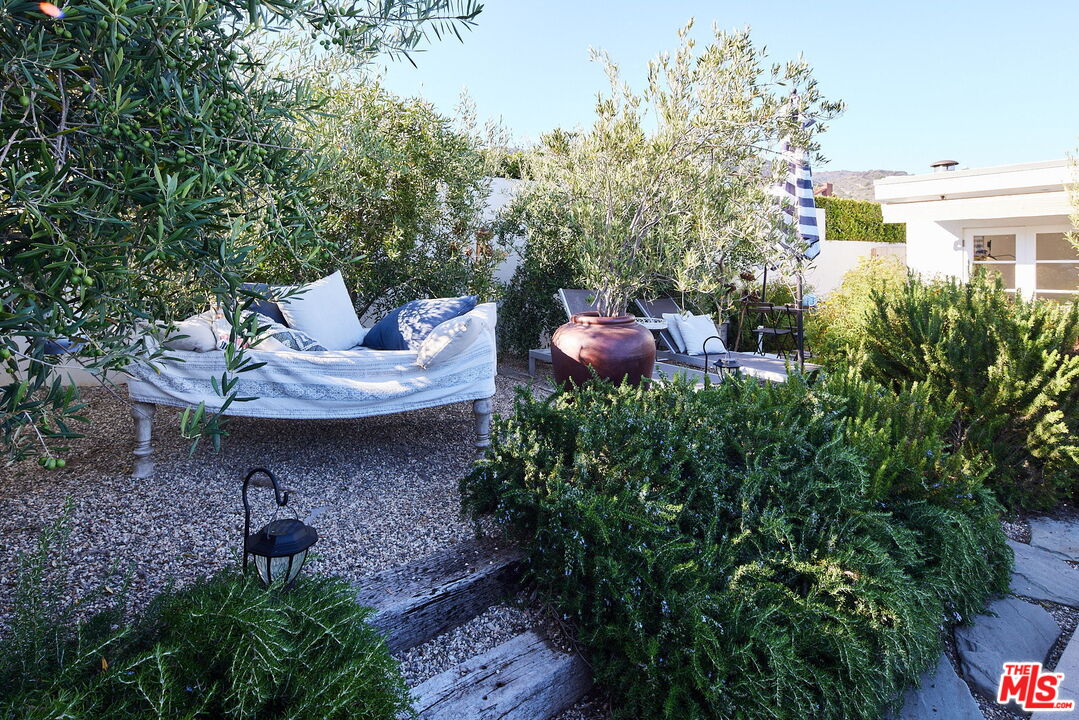 3817 Surfwood Road Malibu, CA 90265 - Photo 23 of 26 a view of a backyard with sitting area