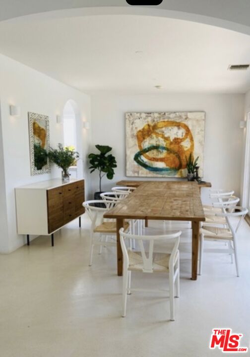 3817 Surfwood Road Malibu, CA 90265 - Photo 10 of 26 a living room with furniture and a flat screen tv