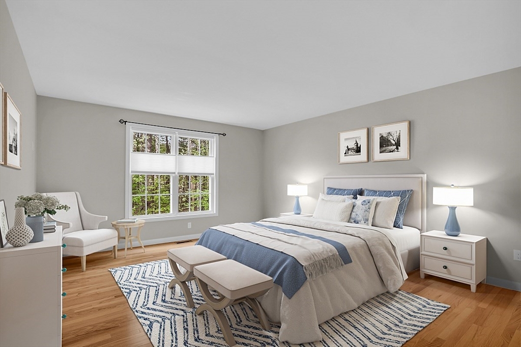 23 Southgate Road, Unit 23 Westford, MA 01886 - Photo 13 of 41 a bedroom with a bed and wooden floor