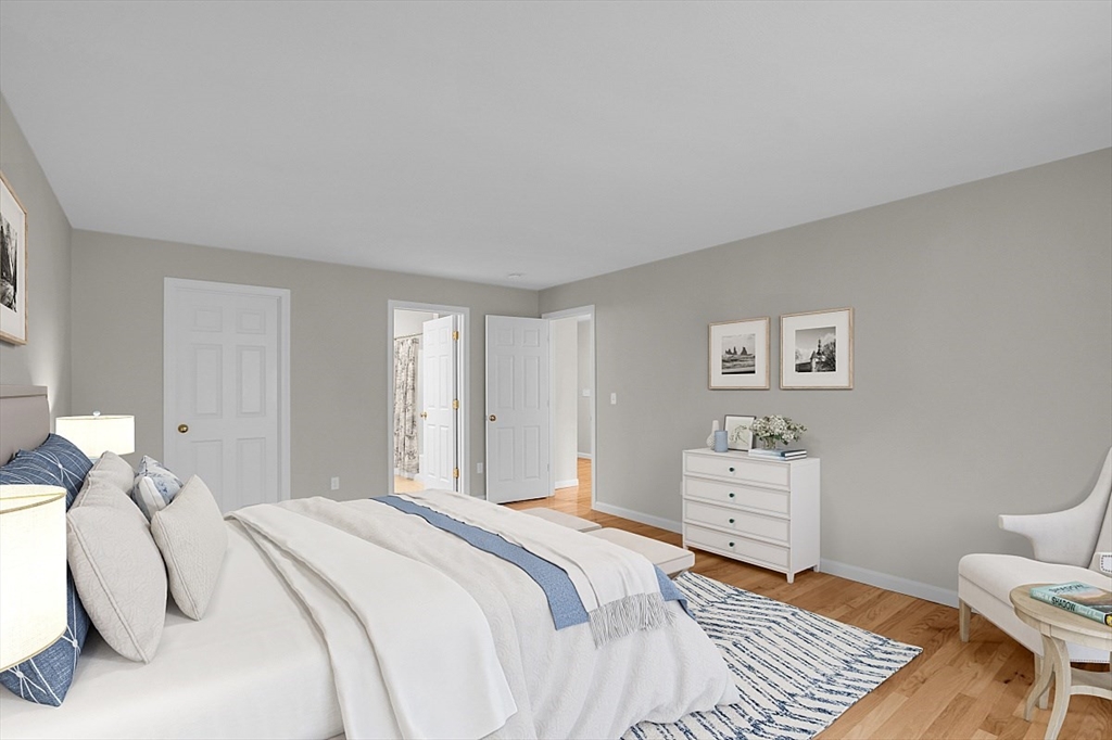23 Southgate Road, Unit 23 Westford, MA 01886 - Photo 14 of 41 a bedroom with a bed and wooden floor