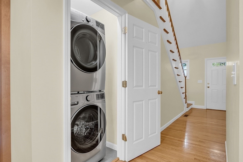 23 Southgate Road, Unit 23 Westford, MA 01886 - Photo 17 of 41 a view of a hallway with washer and dryer
