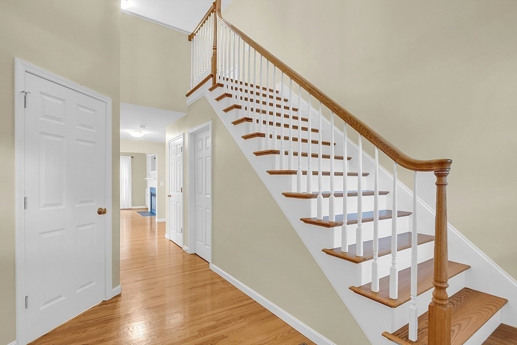 23 Southgate Road, Unit 23 Westford, MA 01886 - Photo 19 of 41 a view of staircase with wooden floor and white walls