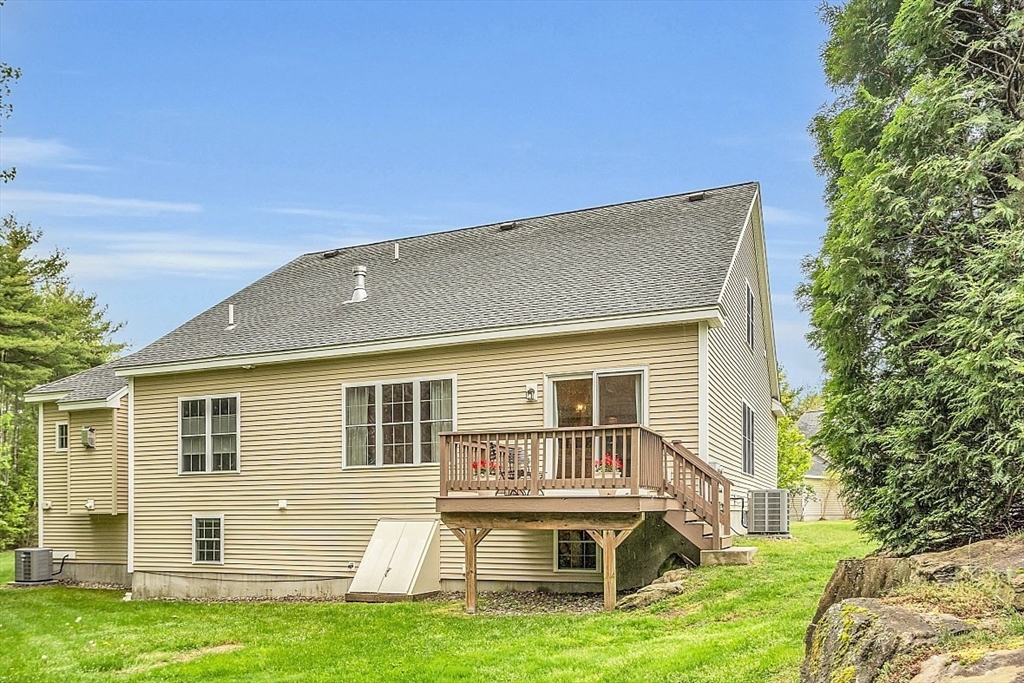 23 Southgate Road, Unit 23 Westford, MA 01886 - Photo 2 of 41 front view of house with a yard