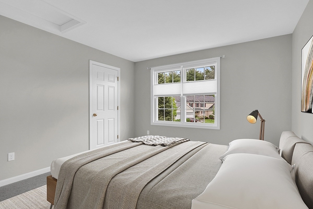 23 Southgate Road, Unit 23 Westford, MA 01886 - Photo 25 of 41 a bedroom with a bed and a window