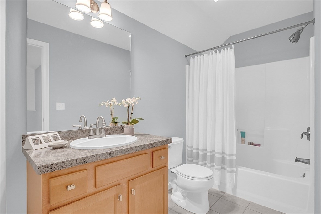 23 Southgate Road, Unit 23 Westford, MA 01886 - Photo 26 of 41 a bathroom with a granite countertop sink toilet and shower