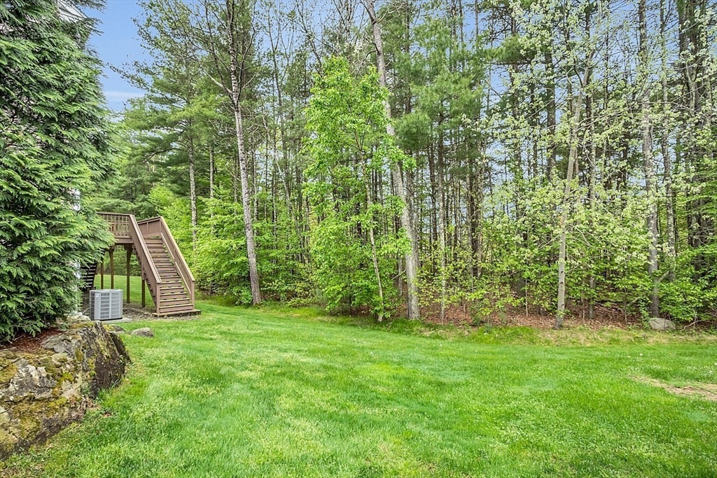 23 Southgate Road, Unit 23 Westford, MA 01886 - Photo 3 of 41 a view of a yard with a slide