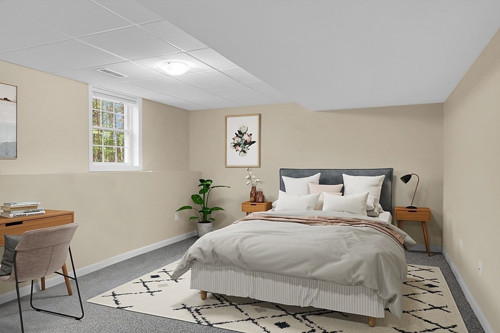 23 Southgate Road, Unit 23 Westford, MA 01886 - Photo 31 of 41 a bedroom with a bed and a potted plant