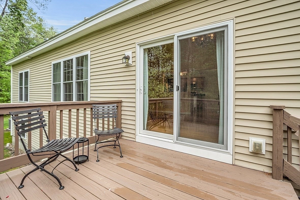 23 Southgate Road, Unit 23 Westford, MA 01886 - Photo 33 of 41 a view of a chair and table in the balcony