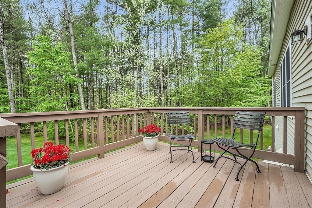 23 Southgate Road, Unit 23 Westford, MA 01886 - Photo 34 of 41 a deck with hardwood table and chairs