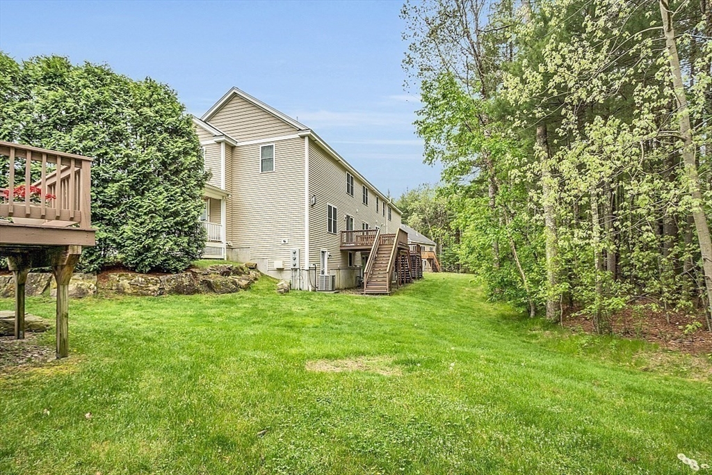 23 Southgate Road, Unit 23 Westford, MA 01886 - Photo 36 of 41 a view of a house with a yard
