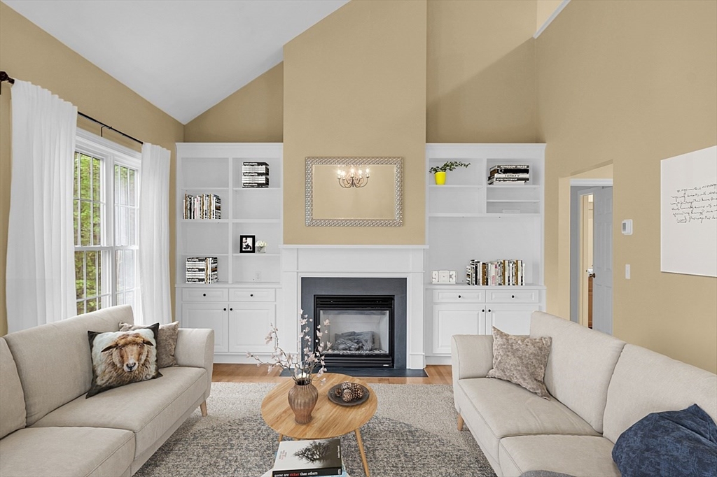 23 Southgate Road, Unit 23 Westford, MA 01886 - Photo 6 of 41 a living room with furniture and a fireplace