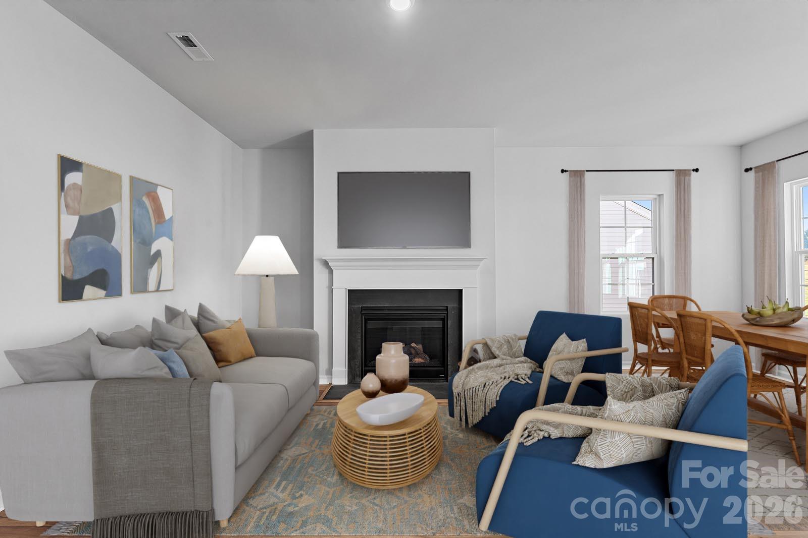 207 Rodeo Drive, Unit 4 Shelby, NC 28150 - Photo 5 of 8 a living room with furniture and a fireplace