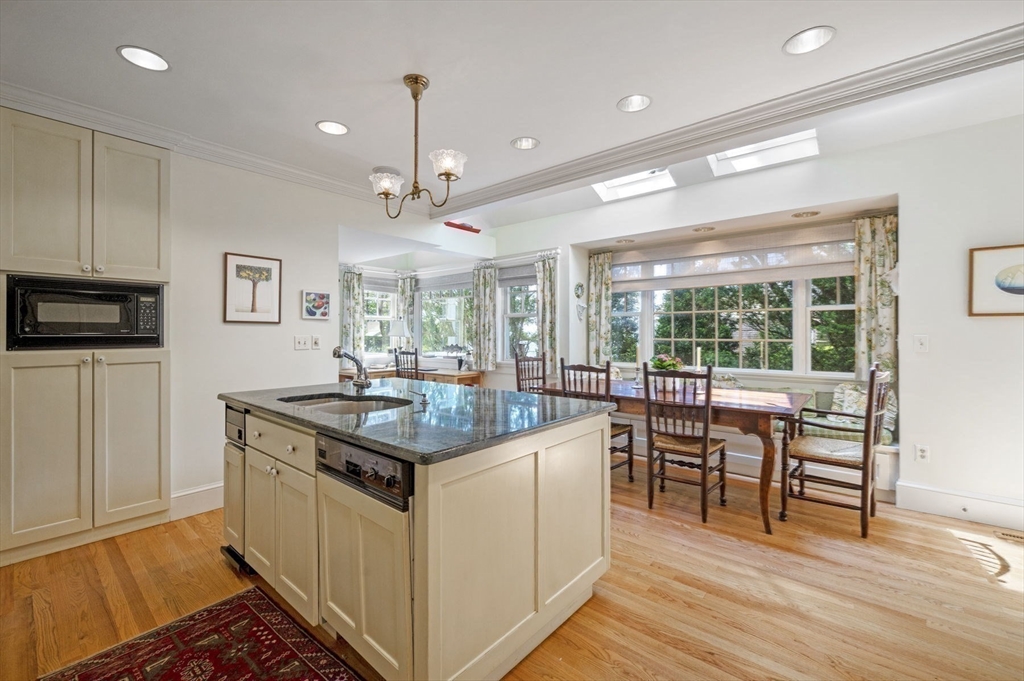 16 Coolidge Road Marblehead, MA 01945 - Photo 14 of 36 a kitchen with stainless steel appliances granite countertop a stove and a sink