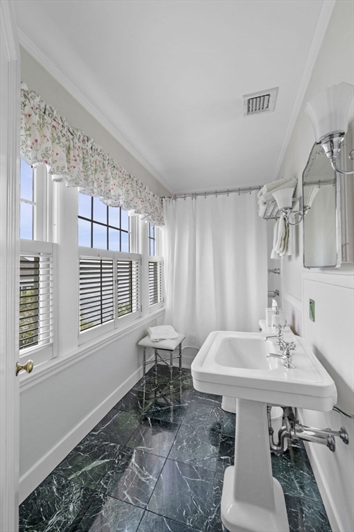 16 Coolidge Road Marblehead, MA 01945 - Photo 21 of 36 a bathroom with a sink and a mirror