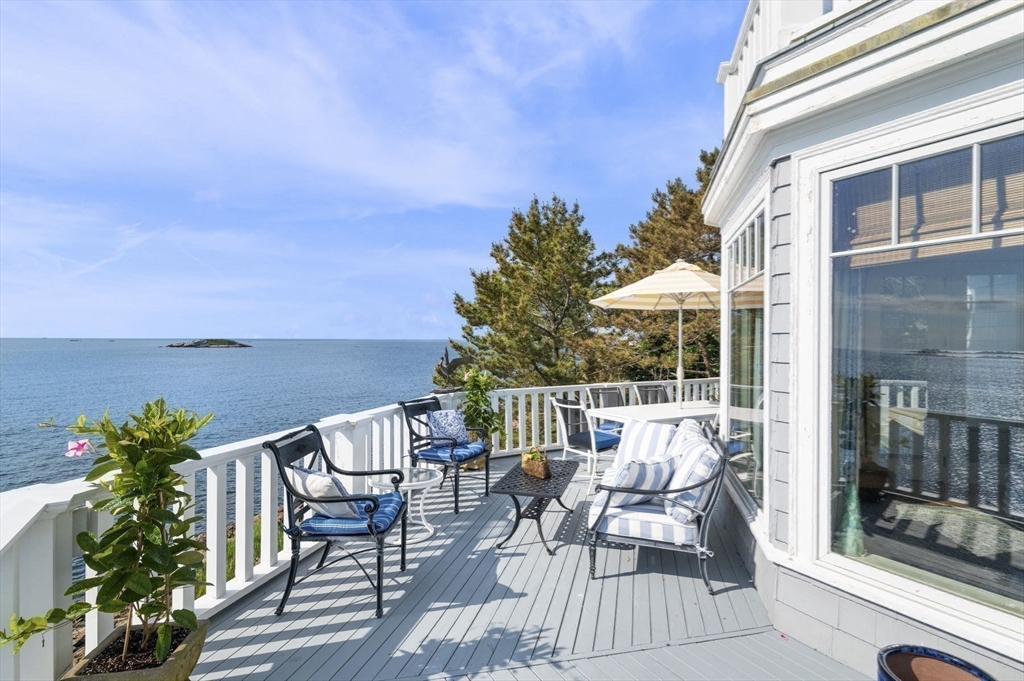 16 Coolidge Road Marblehead, MA 01945 - Photo 10 of 36 a view of a patio with a table chairs and a potted plants