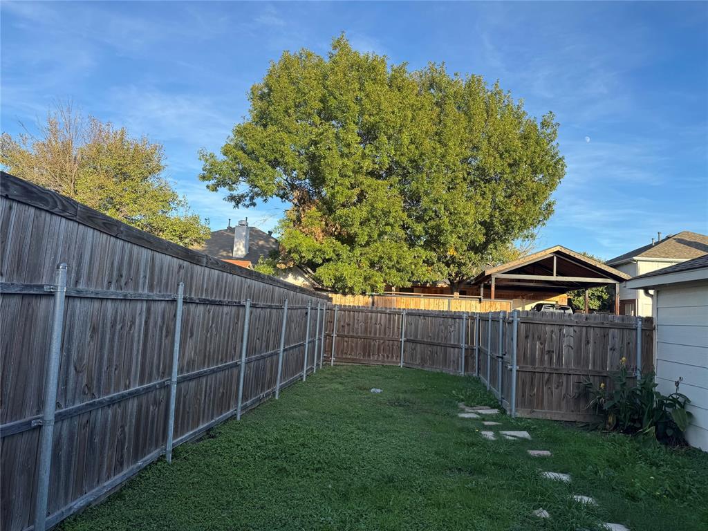 1716 Rancho Drive Mesquite, TX 75149 - Photo 11 of 12 a view of a backyard with a garden
