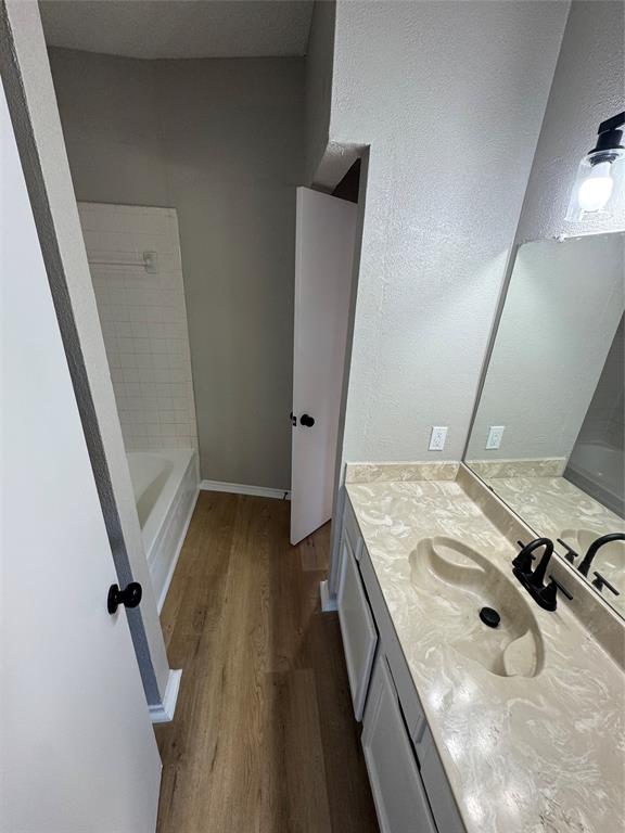 1716 Rancho Drive Mesquite, TX 75149 - Photo 8 of 12 a bathroom with a sink and a mirror