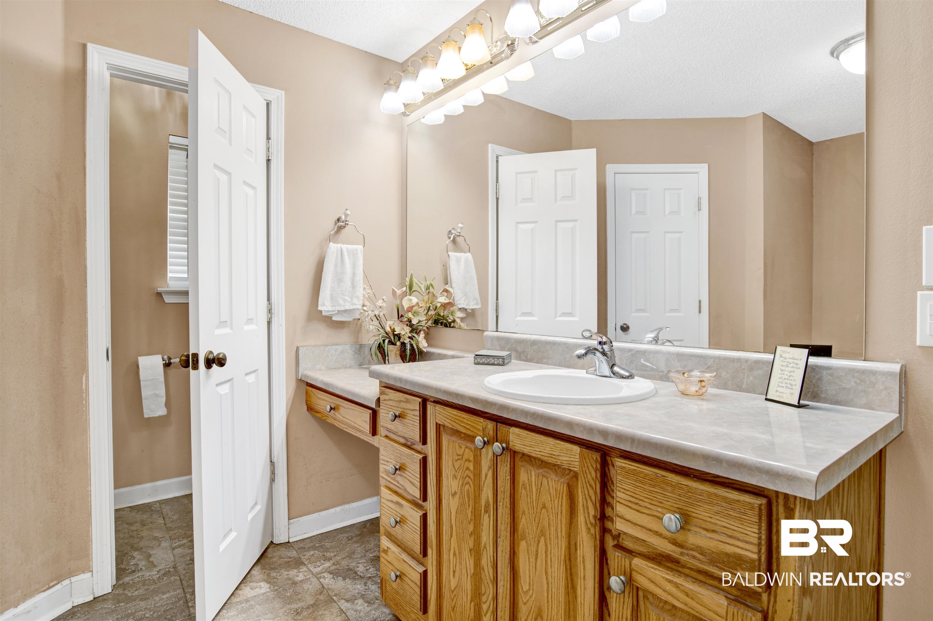 36434 Alexandria Trail Stapleton, AL 36578 - Photo 9 of 27 Bathroom featuring vanity and light tile patterned floors