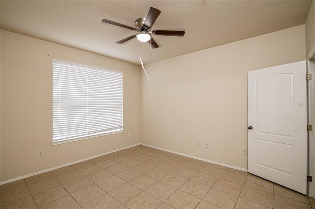 3391 South Kirkman Road, Unit 1216 Orlando, FL 32811 - Photo 16 of 33 an empty room with a window