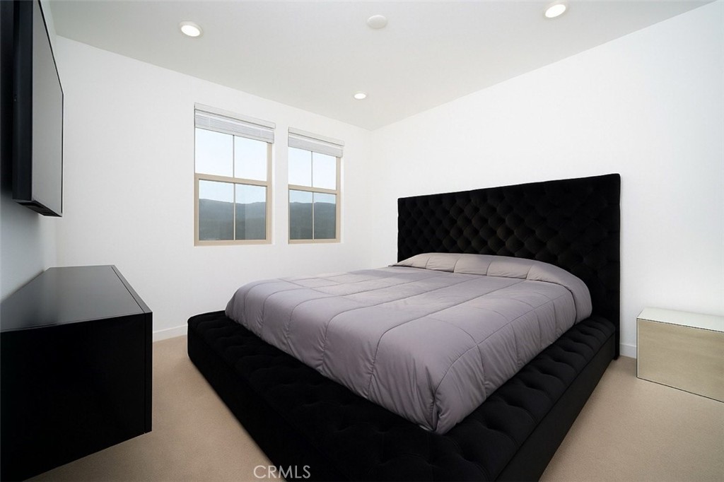 1100 Lasso Way, Unit 204 Rancho Mission Viejo, CA 92694 - Photo 13 of 41 a bedroom with a bed and a window