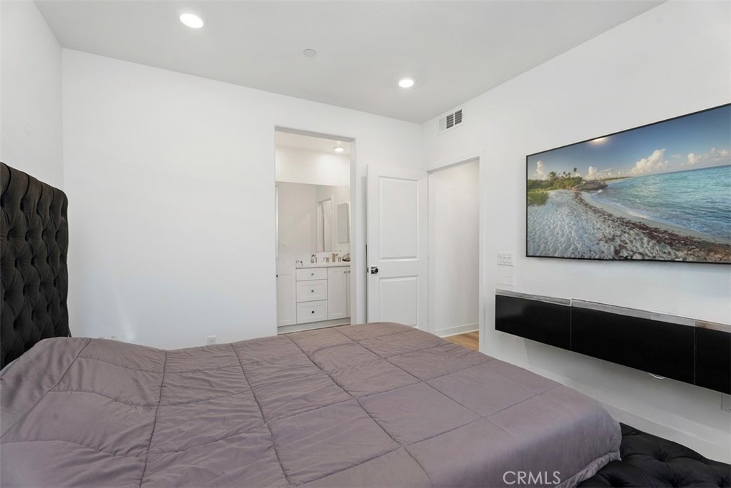 1100 Lasso Way, Unit 204 Rancho Mission Viejo, CA 92694 - Photo 14 of 41 a bedroom with a bed and a painting on the wall