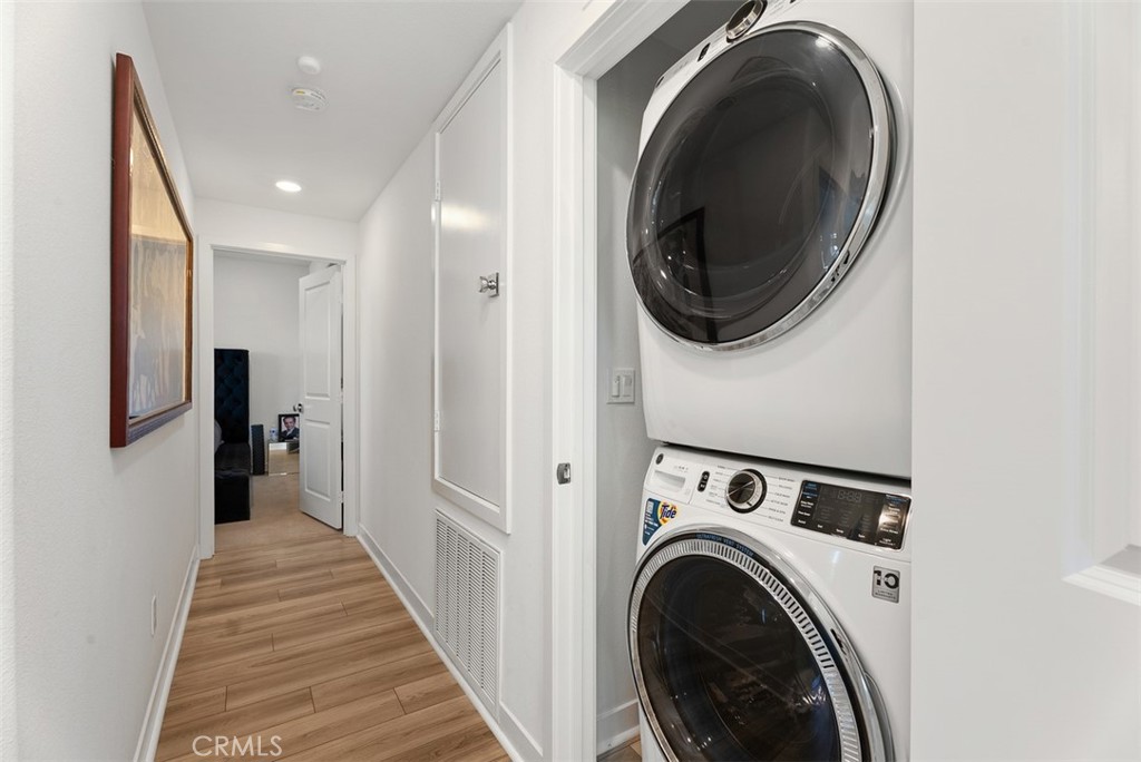 1100 Lasso Way, Unit 204 Rancho Mission Viejo, CA 92694 - Photo 18 of 41 a view of a hallway with washer and dryer