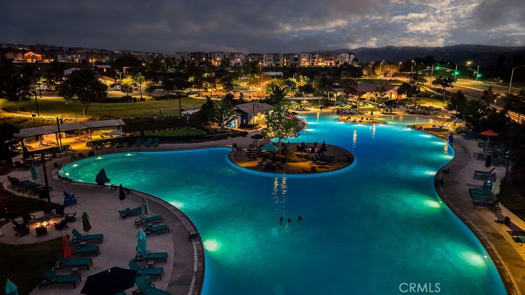1100 Lasso Way, Unit 204 Rancho Mission Viejo, CA 92694 - Photo 31 of 41 a view of a swimming pool of a house with a yard