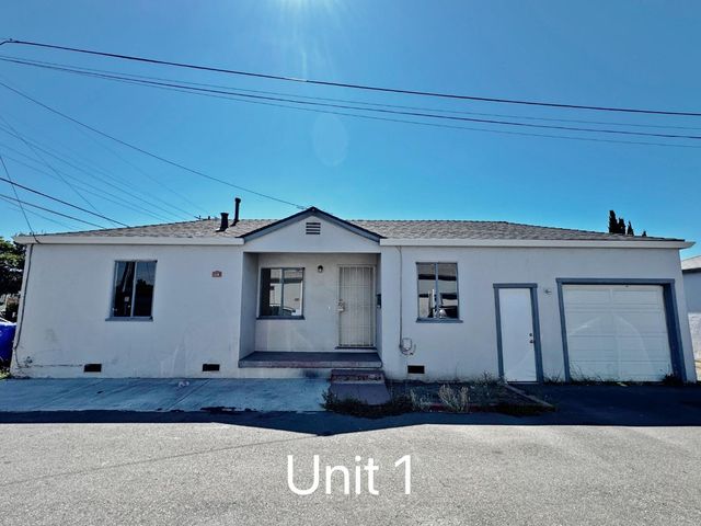 a view of house with wooden fence