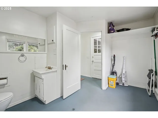 a view of bathroom with a sink toilet and a mirror