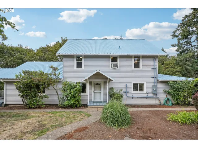 a front view of a house with garden
