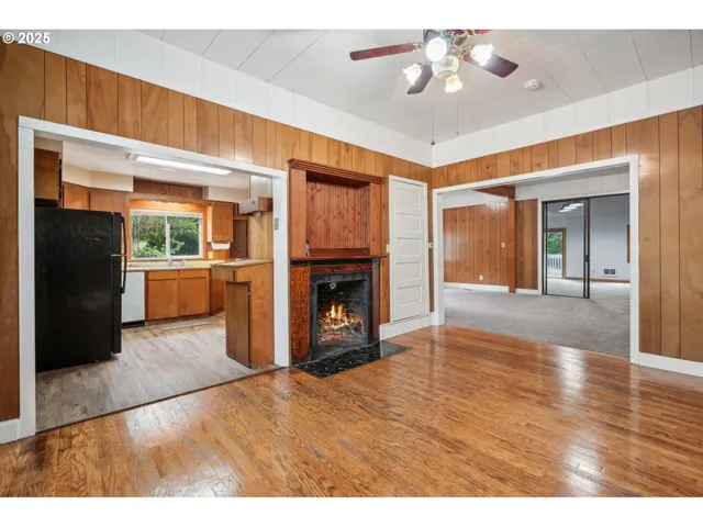 a view interior of a house an empty room fire place and a window