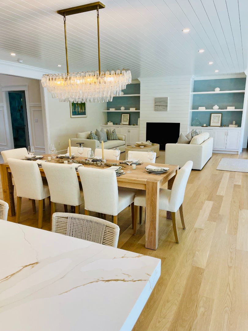 23 Pinehurst Road Edgartown, MA 02539 - Photo 11 of 57 a dining hall with stainless steel appliances kitchen island granite countertop a dining table chairs and a white refrigerator