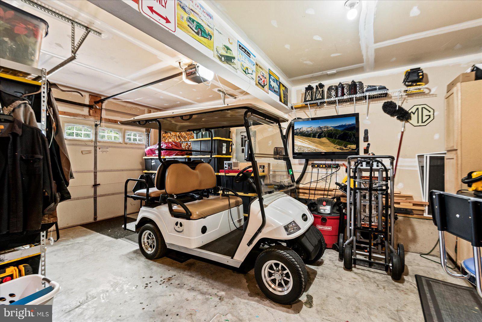 302 Forest Avenue Colonial Beach, VA 22443 - Photo 45 of 56 Electric Golf Cart with Charging Station in Garage
